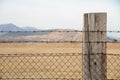 Barbed wire entanglement with wooden post Royalty Free Stock Photo