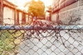 Barbed wire entrance fences prevent intruders from entering restricted areas Royalty Free Stock Photo
