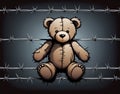 Barbed wire fence with an abandoned teddy bear Royalty Free Stock Photo