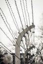 Auschwitz / Oswiecim / Poland - 02.15.2018: Barbed wire fence around a concentration camp.