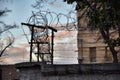 Barbed wire fence around prison walls