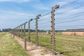 The barbed wire fence and the barracks in concentration camp Auschwitz II - Birkenau.