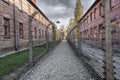 Barbed wire fence and buildings at Auschwitz I - former German Nazi Concentration and Extermination Camp - Poland Royalty Free Stock Photo