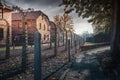 Barbed wire fence and buildings at Auschwitz I -  former German Nazi Concentration and Extermination Camp - Poland Royalty Free Stock Photo