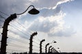 Barbed wire fence in impressive sky. Auschwitz Royalty Free Stock Photo