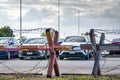 Barbed wire fence of the parking lot. Cars parked at outdoor car parking lot. Car was seized by a lending company. Financial