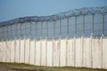 Barbed wire fence on sky background. Lost freedom and hope, crime and punishment concept Royalty Free Stock Photo