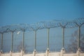 Barbed wire fence on sky background. Lost freedom and hope, crime and punishment concept Royalty Free Stock Photo