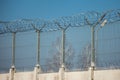 Barbed wire fence on sky background. Lost freedom and hope, crime and punishment concept Royalty Free Stock Photo