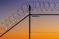 Barbed wire fence at sunset Royalty Free Stock Photo