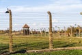 Barbed wire fence with watchtower surrounding extermination camp in Auschwitz Birkenau, Poland