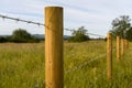 Barbed wire fence in the countryside Royalty Free Stock Photo