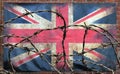 Barbed wire in front of an old stained dirty union jack british flag - brexit isolationist concept