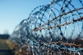 Barbed wire guards, restricting access, a perimeter of caution established Royalty Free Stock Photo