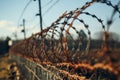 Barbed wire guards, restricting access, a perimeter of caution established Royalty Free Stock Photo