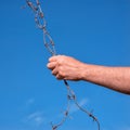 Barbed wire in a hand Royalty Free Stock Photo