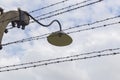 Barbed wire and lantern on a pole Royalty Free Stock Photo