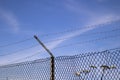 Barbed wire mesh fence Royalty Free Stock Photo