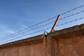 Barbed wire over old concrete wall Royalty Free Stock Photo