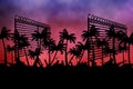 Barbed wire over silhouette of palm trees against sunset sky Royalty Free Stock Photo