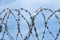 Barbed wire on the sky background Royalty Free Stock Photo