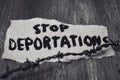 Barbed wire and text stop deportations