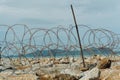 Barbed Wire on Trespass Island with Blue sky