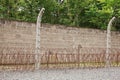 Barbed wire and watchtower at Sachsenhausen concentration camp memorial site. Over 200,000 prisoners were imprisoned here