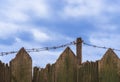 Barbed wire on wooden fence Royalty Free Stock Photo