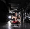 Barbell front squat exercise athletic man during intense workout