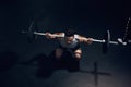 Barbell squat, dark gym and man sports training, workout and fitness of heavy weightlifting in health club. Above of Royalty Free Stock Photo