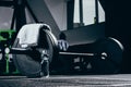 Barbell, towel and bottle of water on floor