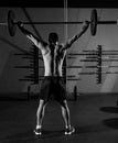 Barbell weight lifting man rear view workout gym Royalty Free Stock Photo