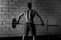 Barbell weight lifting man rear view workout gym Royalty Free Stock Photo