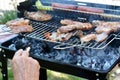 Old man preparing barbeque