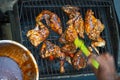 Barbeque pit chicken leg and thigh covered in BBQ sauce Royalty Free Stock Photo