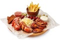 Barbeque plate with meat, french fries and spicy sauce. Royalty Free Stock Photo