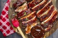 Barbeque ribs sliced on round wooden cutting board Royalty Free Stock Photo