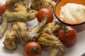 Barbeque wings and fresh tomatoes Royalty Free Stock Photo