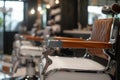 barber chair with chrome accents and wooden armrests in shop