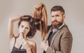 Barber concept. Fashion hairdresser making vogue hair style, modern haircut. Woman with long hair at beauty studio