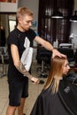 The Barber cuts the hair of customer