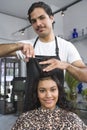 Barber Cutting Woman's Hair