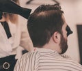 Barber dries the head of man