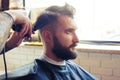 Barber with electric clipper and comb