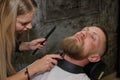 Barber eliminates human stubble with a clipper