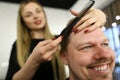 Barber Hairstylist Making Haircut for Man Client