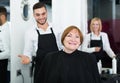 Barber makes the cut for woman Royalty Free Stock Photo