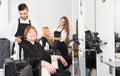 Barber makes the cut for woman Royalty Free Stock Photo