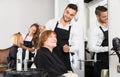 Barber makes the cut for woman Royalty Free Stock Photo